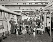 1896. U.S.S. Maine -- berth deck cooks. And their feline mascot